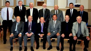 Members of Presbytery present at the ordination Standing left to right: Rev. Peter Loughridge (North Edinburgh); Rev. Andrew Quigley (Airdrie); Mr. D. R. Macdonald (Stornoway); Rev. Tim Donachie; Mr. George Rodger (Airdrie); Mr. Iain Gillies (Glasgow); Mr. Ian Shaw (Airdrie) Seated left to right: Rev. Donald Macdonald (Stornoway); Mr. Sam Bell (Airdrie); Mr. Bill Lucas (Stornoway); Rev. Donnie Mackinnon (Stirling); Rev. Kenneth Stewart (Glasgow); Mr. M.D. Maclean (Stornoway)